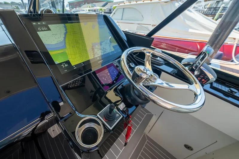 Dealership II Yacht Photos Pics 2023 Scout 530 LXF helm with advanced navigation display and sleek steering wheel.