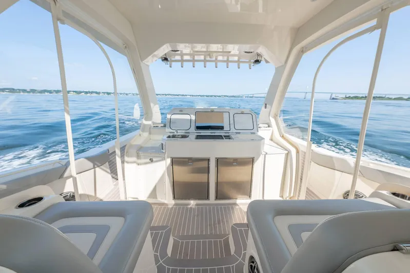 Dealership II Yacht Photos Pics 2023 Scout 530 LXF luxury boat interior with ocean view and modern amenities.