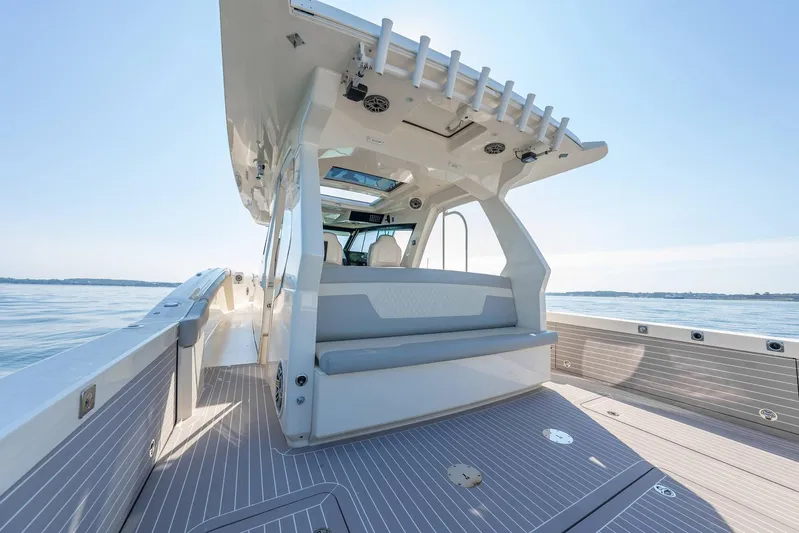 Dealership II Yacht Photos Pics 2023 Scout 530 LXF luxury boat interior with seating, sleek design, and ocean view.