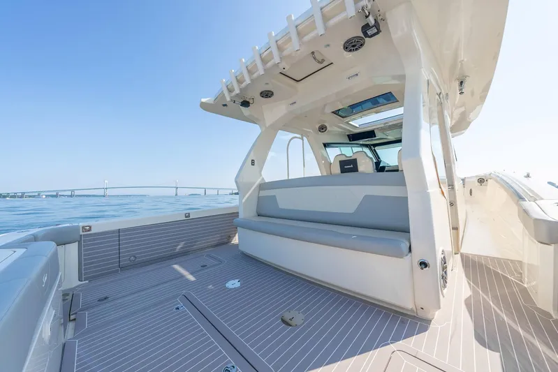 Dealership II Yacht Photos Pics 2023 Scout 530 LXF luxury boat interior with spacious seating and sleek design.