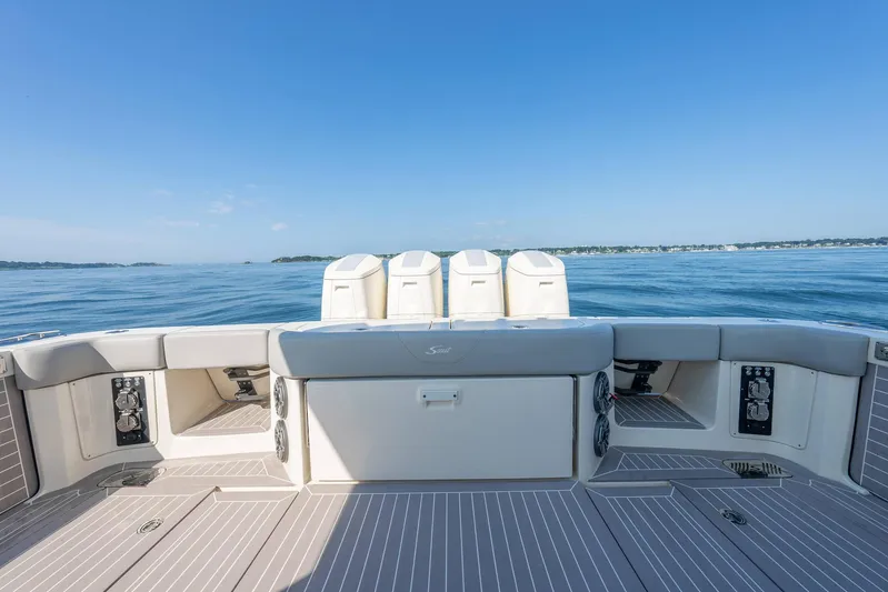 Dealership II Yacht Photos Pics 2023 Scout 530 LXF boat deck with ocean view, showcasing luxury and spacious design.