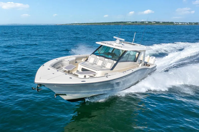 Dealership II Yacht Photos Pics 2023 Scout 530 LXF luxury boat cruising on open water.