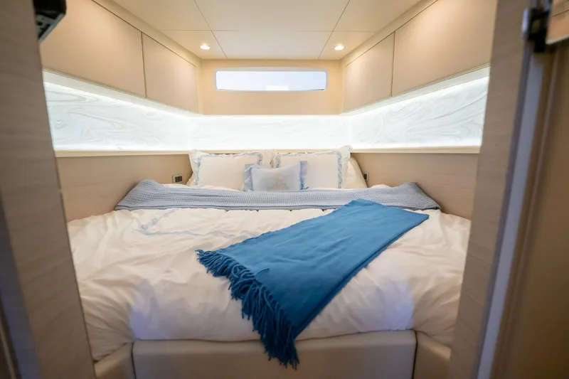 Dealership II Yacht Photos Pics Luxurious cabin interior of 2023 Scout 530 LXF yacht with cozy bedding.