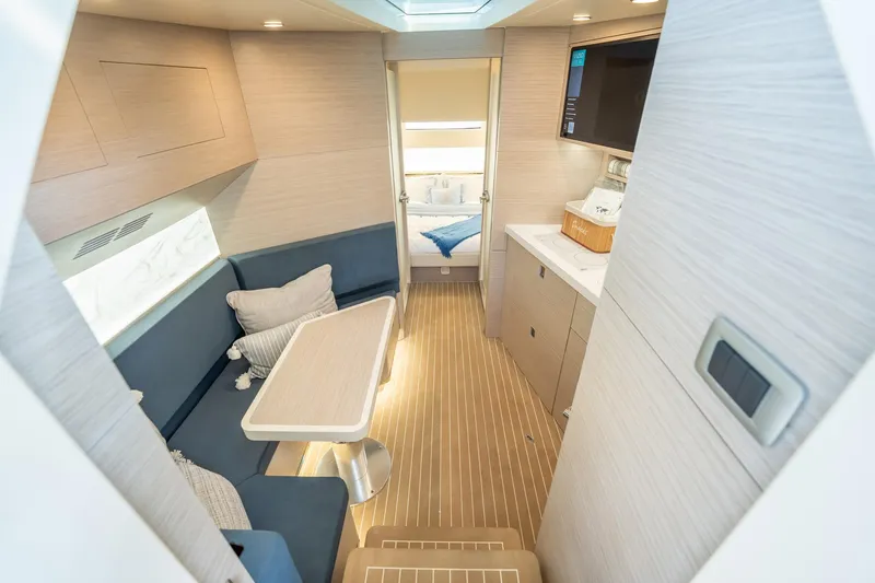 Dealership II Yacht Photos Pics Luxurious interior of 2023 Scout 530 LXF yacht with modern seating and kitchenette.