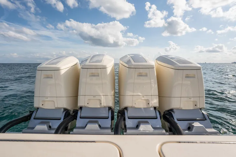 Dealership II Yacht Photos Pics 2023 Scout 530 LXF boat with four powerful outboard engines on open water.