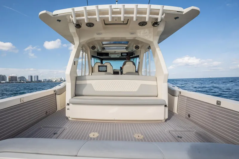 Dealership II Yacht Photos Pics 2023 Scout 530 LXF luxury boat interior with ocean view and city skyline.