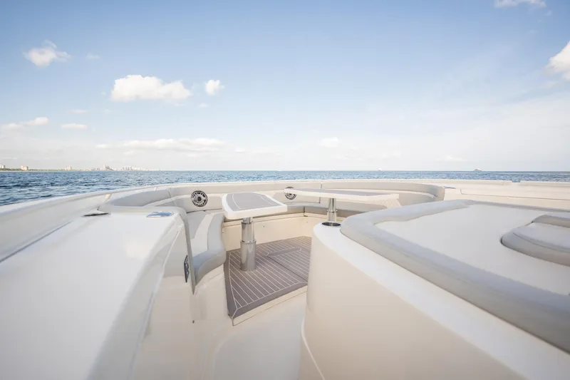Dealership II Yacht Photos Pics 2023 Scout 530 LXF boat interior with ocean view, featuring sleek seating and modern design.