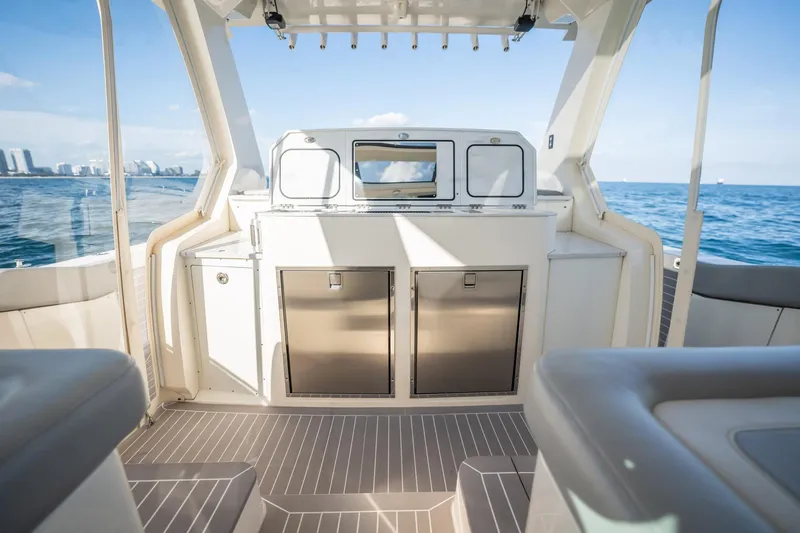 Dealership II Yacht Photos Pics Interior view of 2023 Scout 530 LXF boat with ocean backdrop.