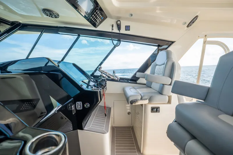 Dealership II Yacht Photos Pics 2023 Scout 530 LXF boat interior with modern helm and luxurious seating.