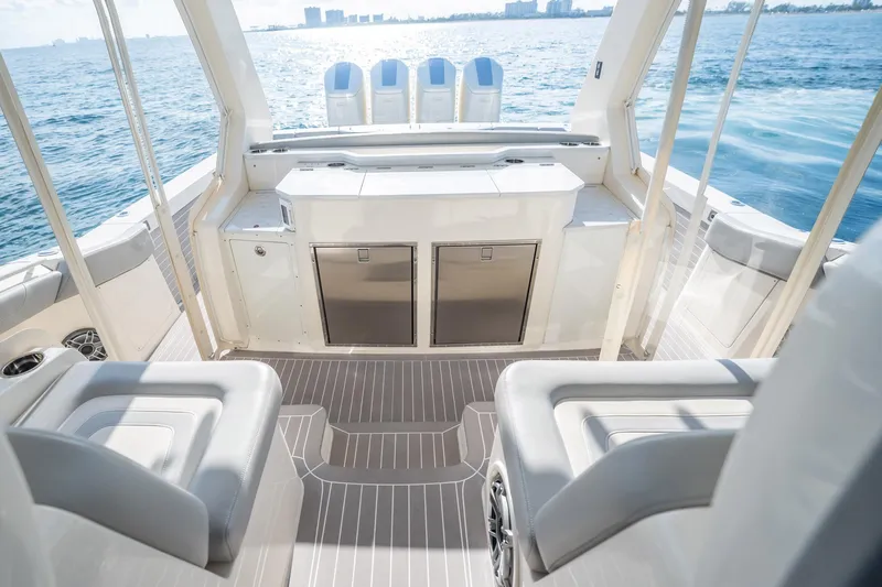 Dealership II Yacht Photos Pics 2023 Scout 530 LXF boat interior with luxurious seating and ocean view.