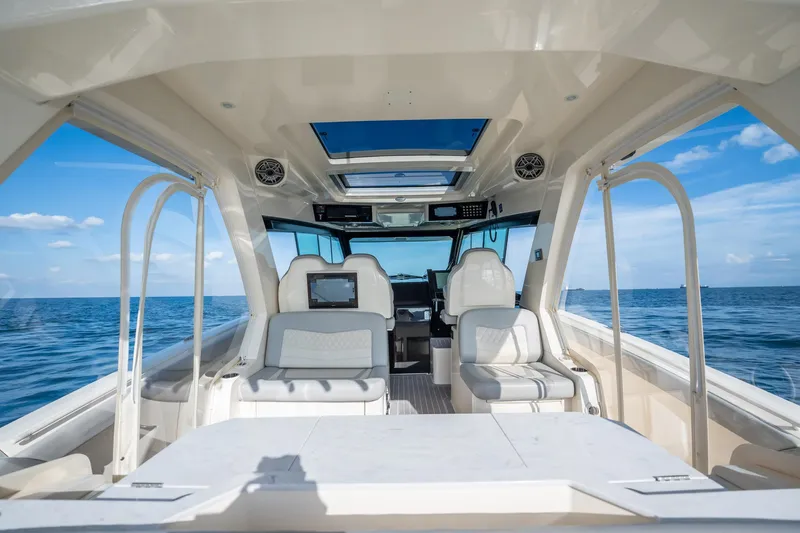 Dealership II Yacht Photos Pics Interior view of 2023 Scout 530 LXF luxury boat on open sea.