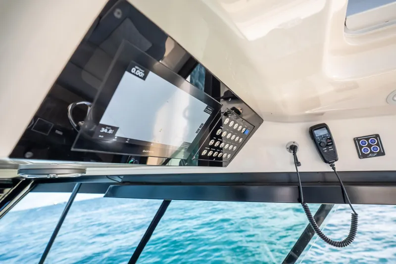 Dealership II Yacht Photos Pics 2023 Scout 530 LXF boat dashboard with navigation and communication equipment.