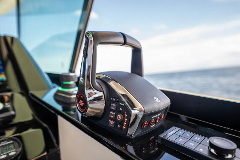 Dealership II Yacht Photos Pics 2023 Scout 530 LXF boat control panel with throttle and navigation controls.