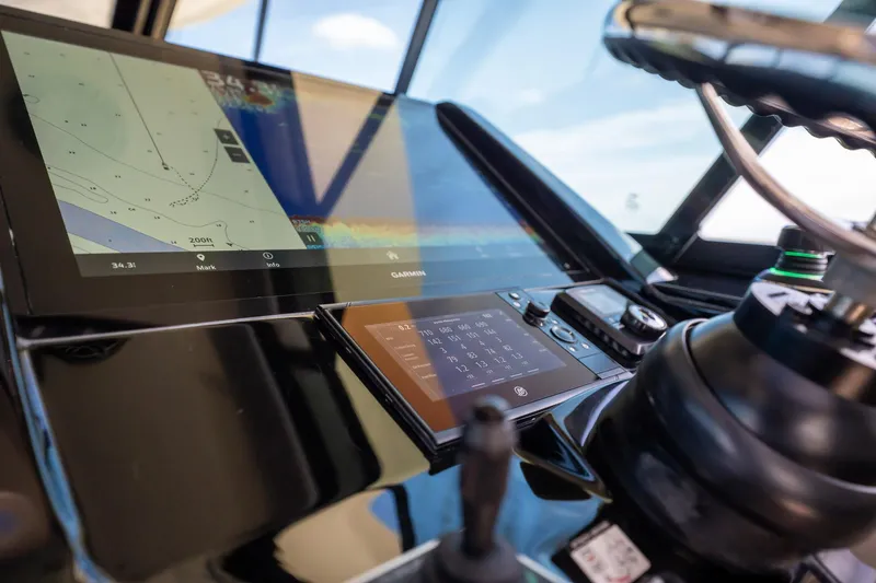 Dealership II Yacht Photos Pics 2023 Scout 530 LXF boat dashboard with navigation and control screens.