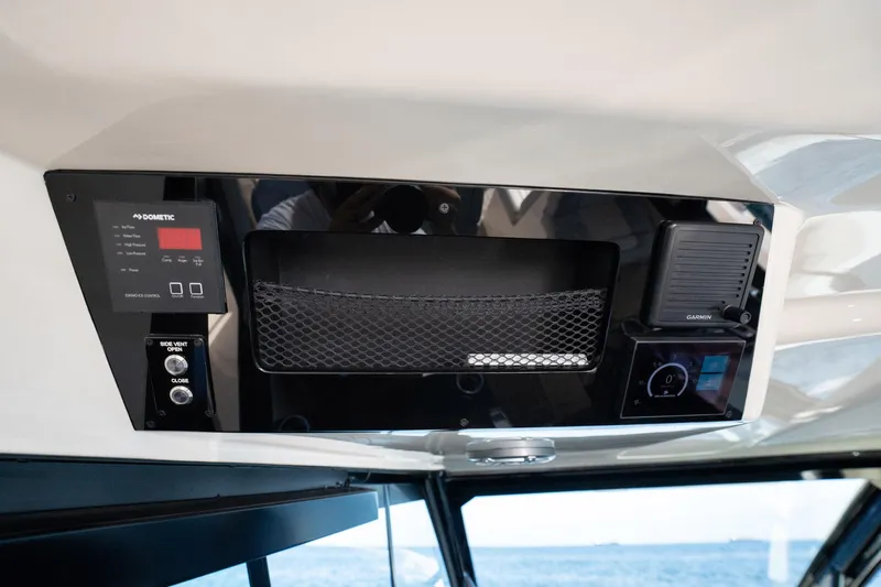 Dealership II Yacht Photos Pics Control panel of 2023 Scout 530 LXF boat with Dometic and Garmin systems.