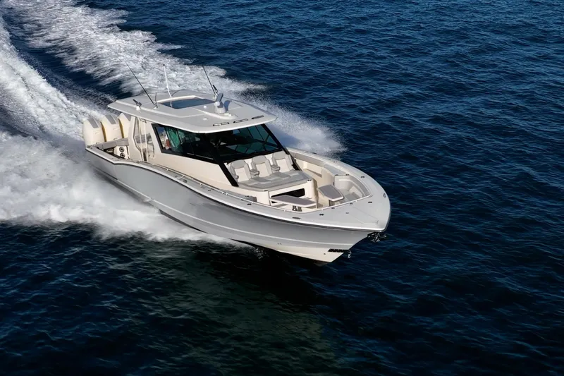 Dealership II Yacht Photos Pics 2023 Scout 530 LXF luxury boat cruising on open water.