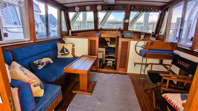 Safari Yacht Photos Pics Interior of a 1990 Stanley Downeast Lobster Yacht with blue seating and nautical decor.