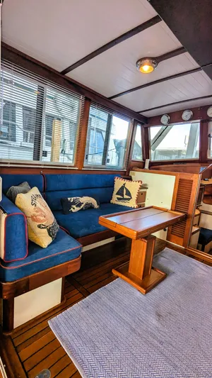 Safari Yacht Photos Pics Interior of 1990 Stanley Downeast Lobster Yacht with blue seating and nautical decor.
