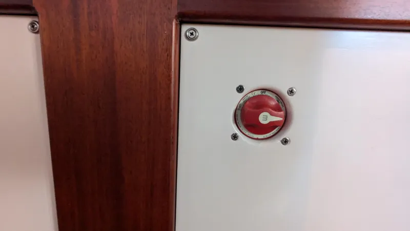 Safari Yacht Photos Pics Red switch on Stanley Downeast Lobster Boat, 1990 model, with wooden paneling.