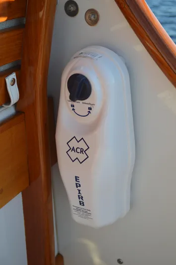 Safari Yacht Photos Pics EPIRB device on 1990 Stanley Downeast Lobster Yacht, mounted on wooden panel.