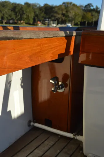 Safari Yacht Photos Pics 1990 Stanley Downeast Lobster Boat with polished wood details and metal fixtures.