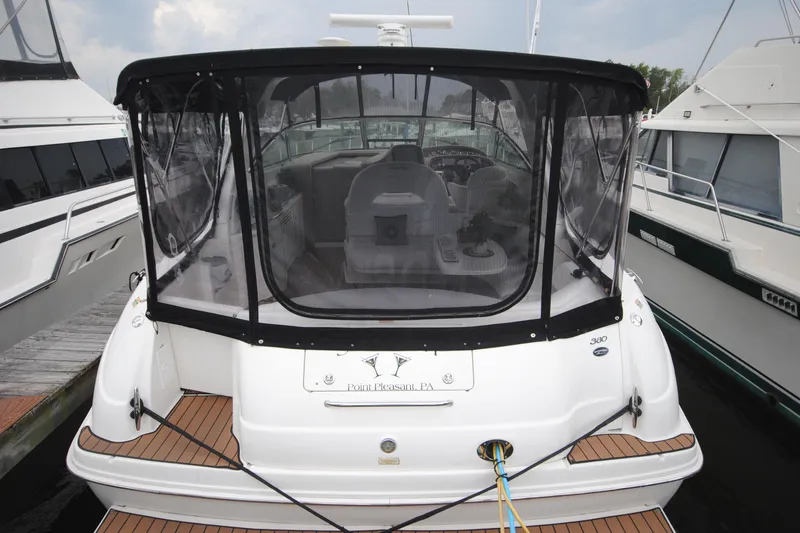  Yacht Photos Pics 2002 Sea Ray 380 Sundancer yacht docked with covered cockpit and wooden deck.