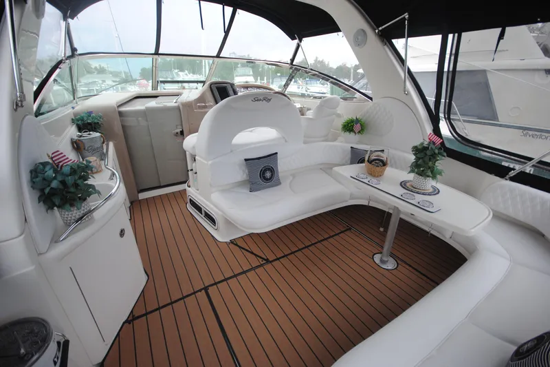  Yacht Photos Pics Luxurious interior of 2002 Sea Ray 380 Sundancer yacht with elegant seating and decor.