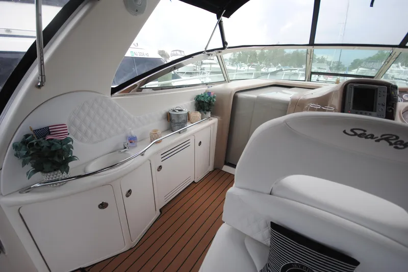  Yacht Photos Pics Luxurious interior of 2002 Sea Ray 380 Sundancer yacht with elegant seating and decor.
