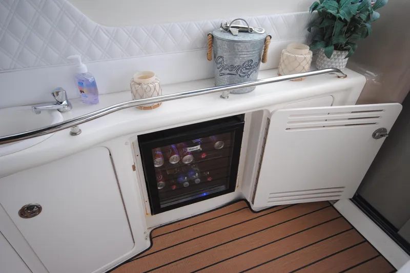  Yacht Photos Pics Interior of 2002 Sea Ray 380 Sundancer with mini fridge and sink area.