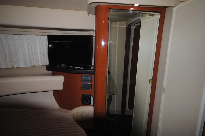  Yacht Photos Pics Interior of 2002 Sea Ray 380 Sundancer with TV and wooden accents.