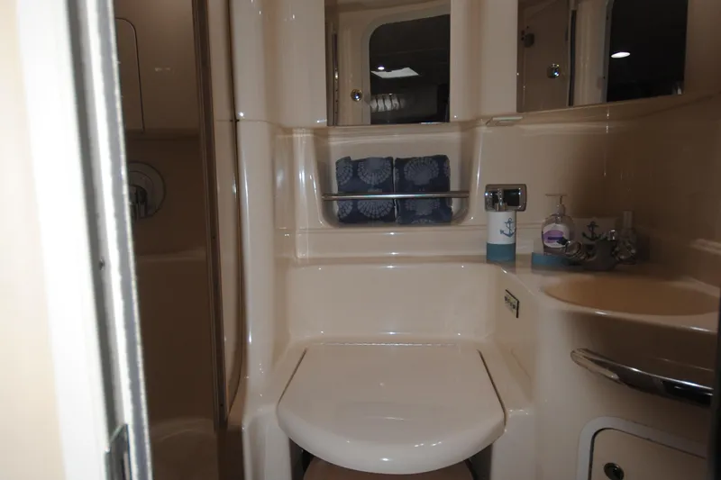  Yacht Photos Pics 2002 Sea Ray 380 Sundancer bathroom with modern fixtures and nautical decor.