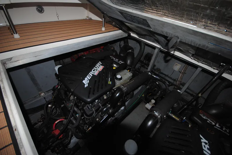  Yacht Photos Pics Engine compartment of 2002 Sea Ray 380 Sundancer with Mercury engines visible.
