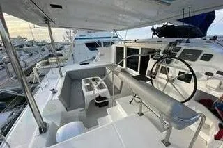  Yacht Photos Pics 2008 Lagoon 420 yacht cockpit with steering wheel and seating area.