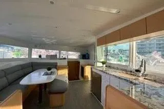  Yacht Photos Pics Interior of 2008 Lagoon 420 catamaran with modern kitchen and dining area.