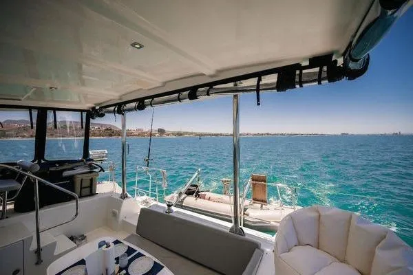  Yacht Photos Pics 2008 Lagoon 420 yacht interior with ocean view, featuring seating and dining area.