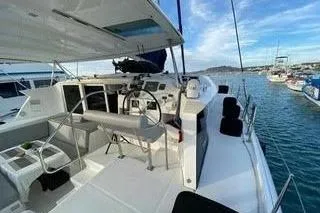  Yacht Photos Pics 2008 Lagoon 420 catamaran with spacious deck and modern controls, docked at marina.