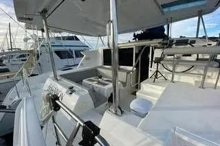  Yacht Photos Pics 2008 Lagoon 420 yacht deck with seating and helm, docked at marina.