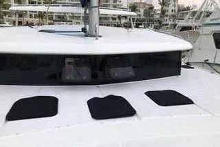  Yacht Photos Pics 2008 Lagoon 420 catamaran deck with windows and hatches in a marina setting.