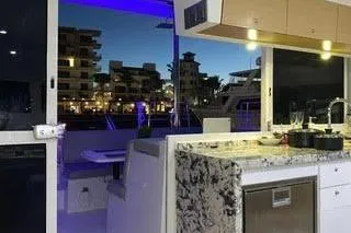  Yacht Photos Pics Interior of 2008 Lagoon 420 yacht with modern kitchen and marina view.