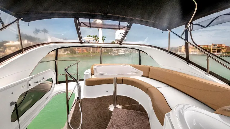 Panache Yacht Photos Pics 2016 Meridian 391 Sedan interior with panoramic windows and plush seating.