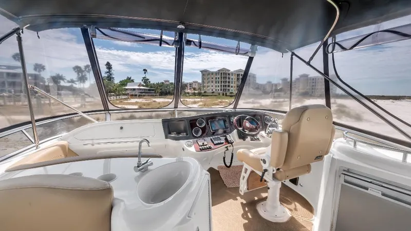 Panache Yacht Photos Pics 2016 Meridian 391 Sedan yacht cockpit with modern controls and panoramic view.