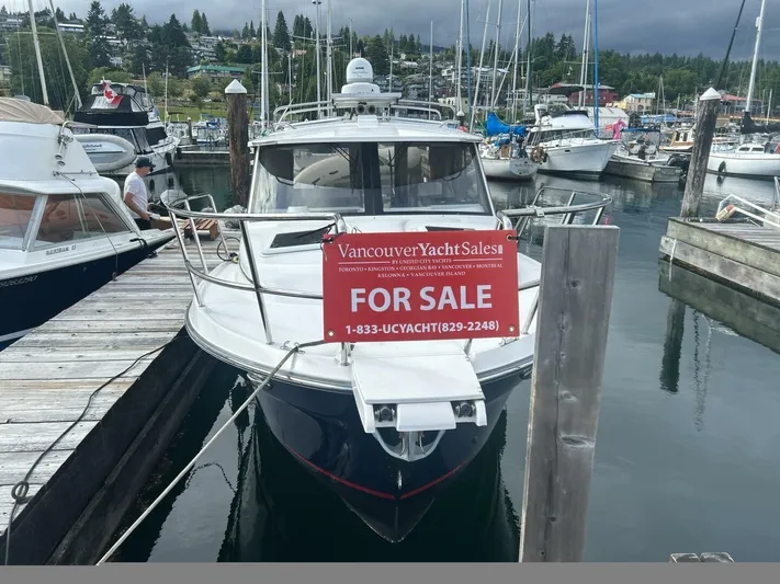  Yacht Photos Pics 2019 Cutwater C-28 yacht for sale at marina, Vancouver Yacht Sales sign displayed.