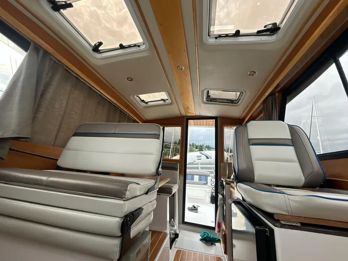  Yacht Photos Pics Interior of 2019 Cutwater C-28 boat with modern seating and skylights.