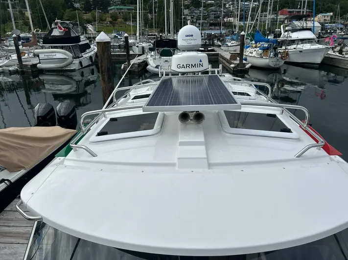  Yacht Photos Pics 2019 Cutwater C-28 boat with solar panel docked in a marina.