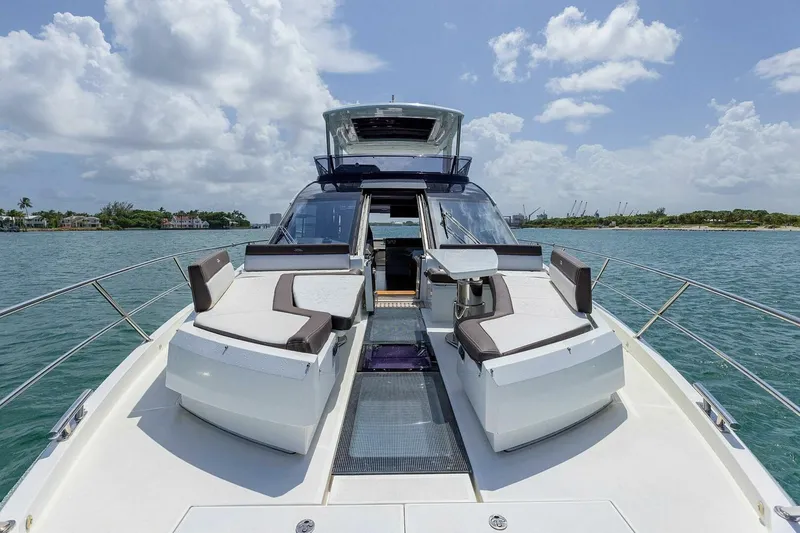  Yacht Photos Pics 2019 Galeon 640 Fly yacht with luxurious deck seating on open water.