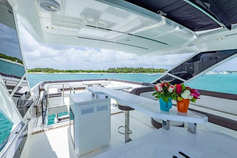  Yacht Photos Pics Luxurious 2019 Galeon 640 Fly yacht deck with ocean view and vibrant flowers.