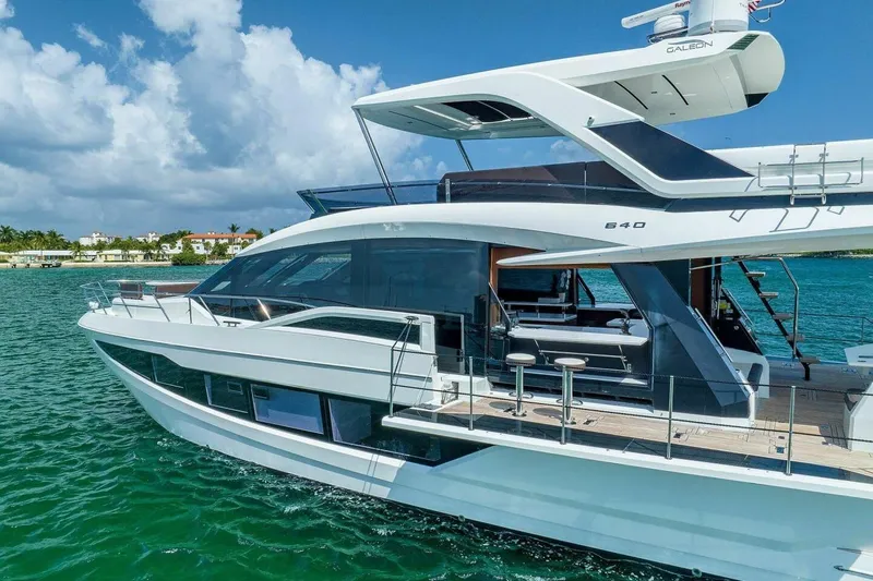  Yacht Photos Pics Luxury 2019 Galeon 640 Fly yacht cruising on clear blue waters.