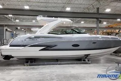 Oceanholic Yacht Photos Pics 2018 Formula 330 Crossover Bowrider in showroom, sleek design, gray and white exterior.