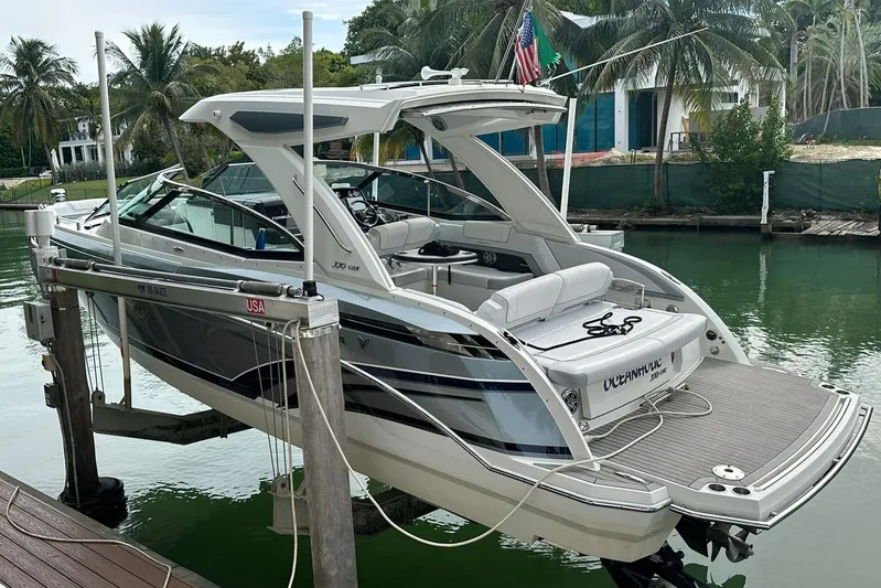 Oceanholic Yacht Photos Pics 2018 Formula 330 Crossover Bowrider docked, featuring sleek design and spacious seating.