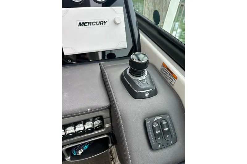 Oceanholic Yacht Photos Pics Control panel of 2018 Formula 330 Crossover Bowrider with Mercury joystick and switches.